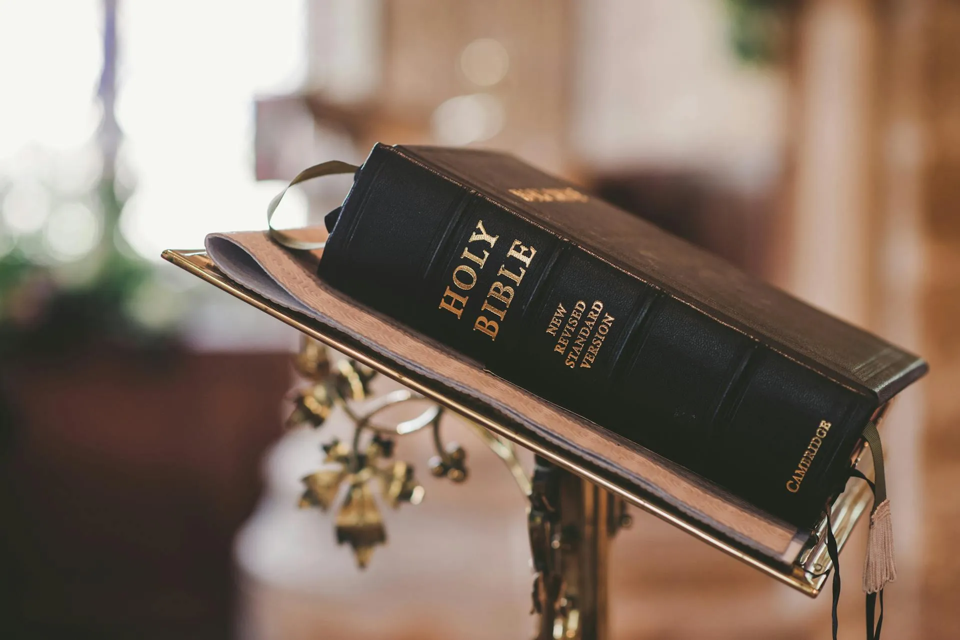 Open Bible on a desk representing our faith-driven approach to church technology